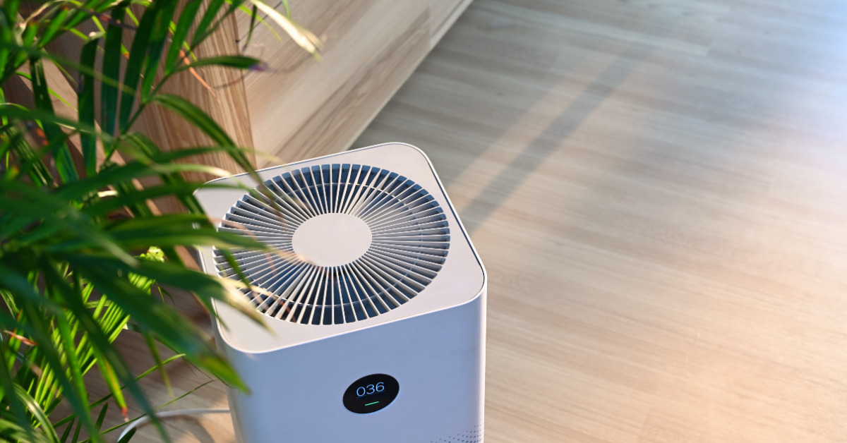 Indoor-Air-Quality-Blog Indoor air quality shown with an air purifier and a house plant