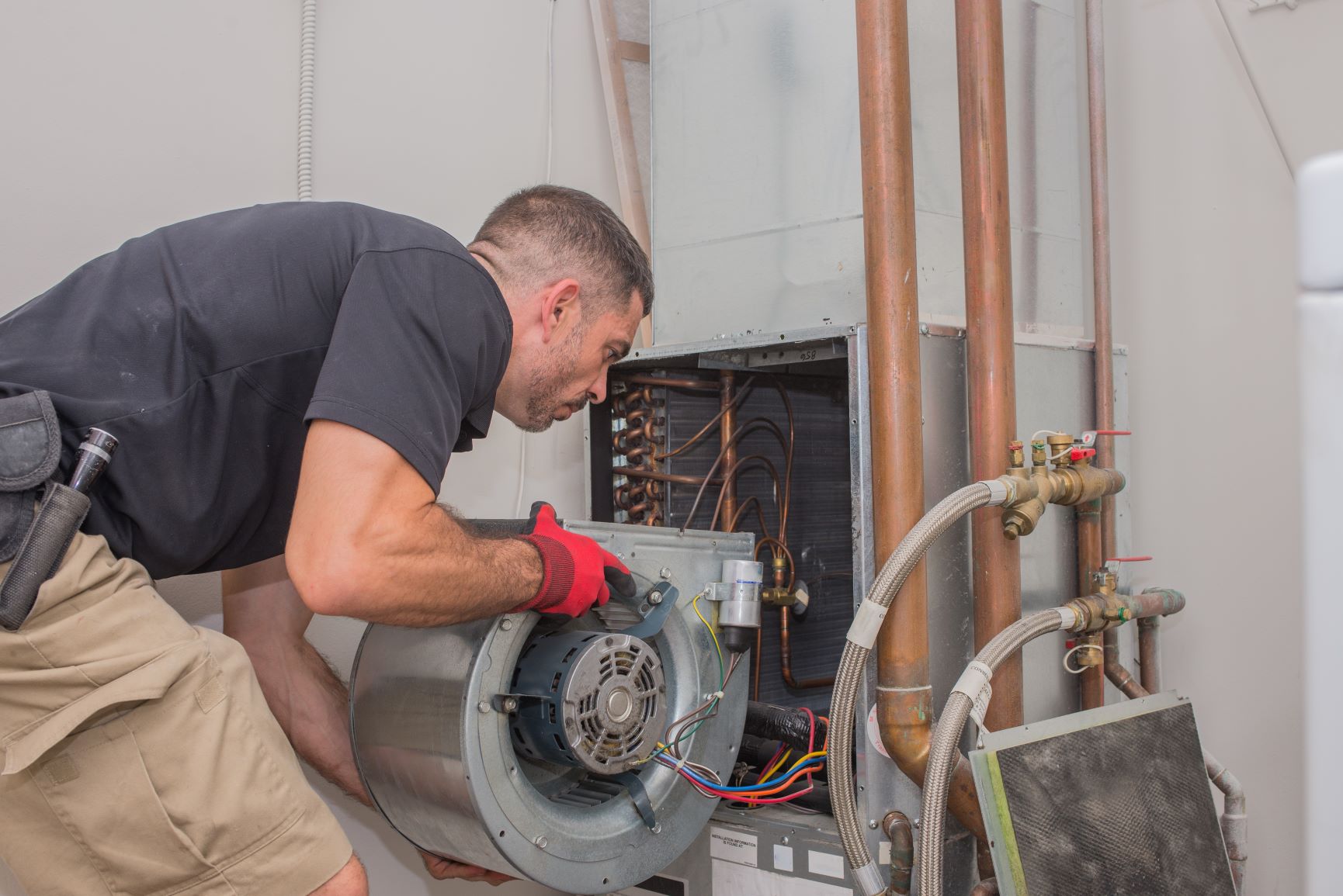 Technician working on replacing air unit